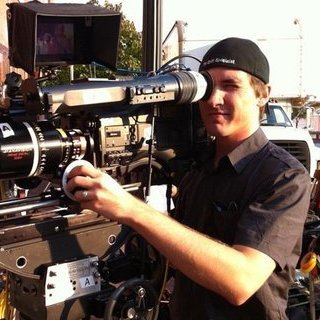 Man works large video camera