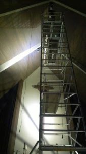 Ladder leading up to arched lighting scheme