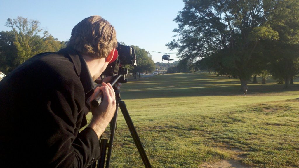 Man films a helicopter landing