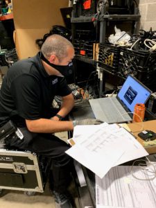 Technician reviews a file on their laptop