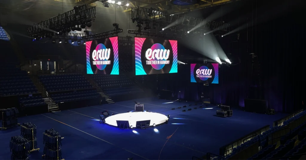 In-the-round LED video wall configuration for a Fortune 100 corporate conference at a Columbus Georgia arena, produced by Atlanta Pro AV.