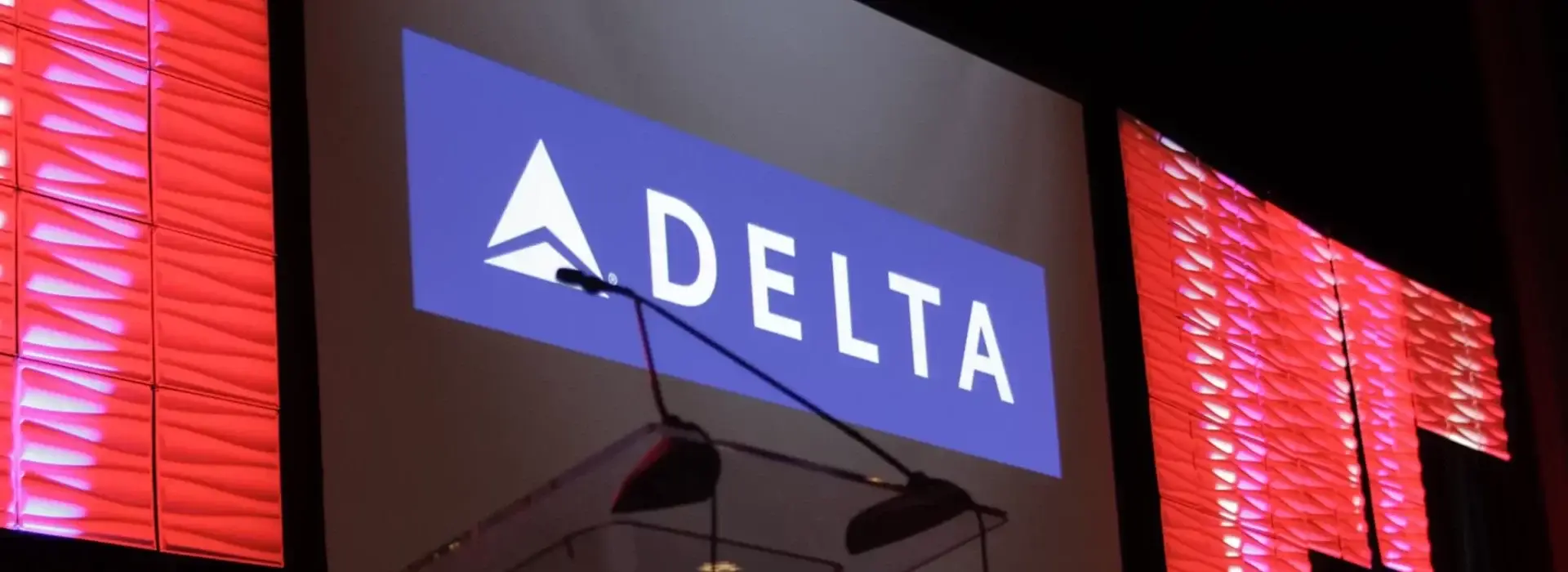 Delta logo on stage at APAV event production